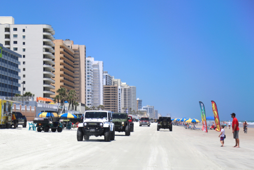 Jeeps driving on beach