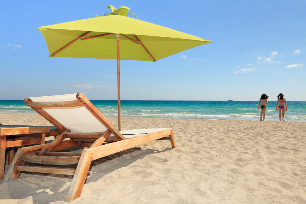 lounge chairs and umbrella on beach